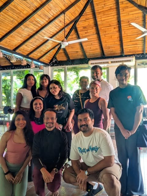 Soul Groove participants together in the open, timber-roofed gathering space