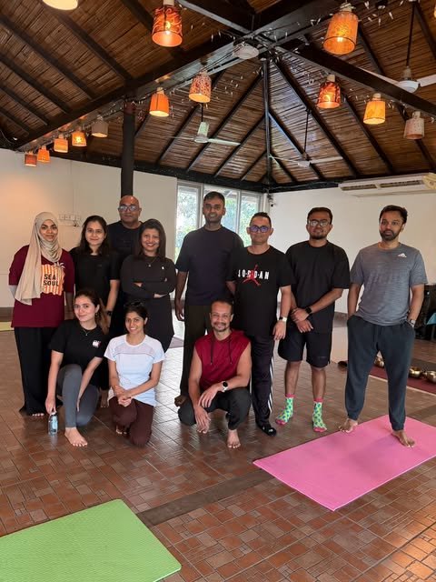 Participants gathered on yoga mats beneath the timber roof after a Soul Groove morning